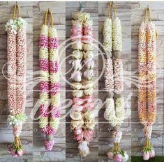 several different types of flowers hanging from strings