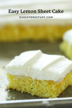 a piece of cake with white frosting sitting on top of a metal pan next to a fork