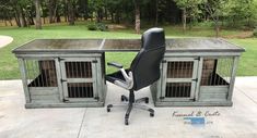 an office desk made out of crates with a black leather chair in front of it