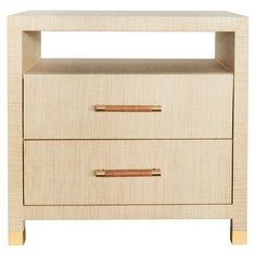 the two drawers are made from wood and have gold handles on each drawer, which is also available for storage