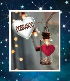 a glass jar with a heart hanging from it's side and the words dobrano written on top