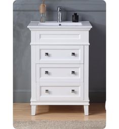 a white bathroom vanity with drawers and a mirror on the wall above it, in front of a gray wall