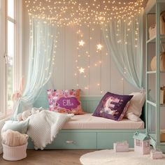 a bedroom with fairy lights hanging from the ceiling, and a window seat in front of it