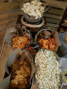 several bowls filled with different types of food on top of a table next to other foods