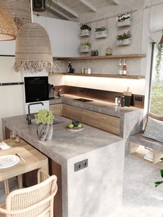 a kitchen with an island made out of concrete and plants on the counter top, along with wicker baskets hanging from the ceiling