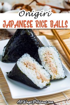 an image of japanese rice balls on a plate with chopsticks