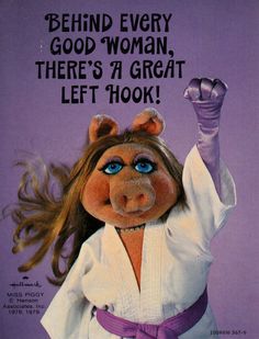 an advertisement for the muppet show with a woman dressed in karate attire and holding her fist up