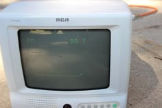 an old tv sitting on the ground with no signal in it's display screen