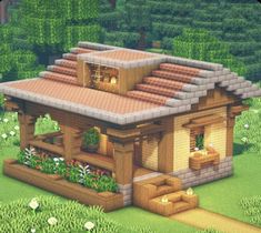 a small wooden house sitting on top of a lush green field