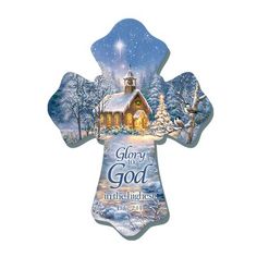 an ornament shaped like a cross with the words glory to god on it