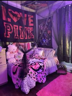 a bed with pink and purple decor in a room