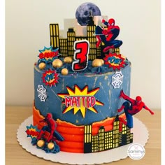 a spiderman themed birthday cake with the number 3 on it's top tier