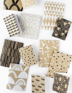 several different types of patterned paper on a white surface with black dots and lines in the middle