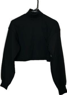 Trendy Black Cropped Sweater For Streetwear, Black Trendy Cropped Sweater For Streetwear, Fitted Black Sweater With Funnel Neck, Casual Black Turtleneck Crop Top, Fitted Black Cropped Long Sleeve Sweater, Fitted Black Cropped Sweater, Black Turtleneck Cropped Sweater Casual, Black Crew Neck Winter Crop Top, Casual Black Turtleneck Cropped Sweater