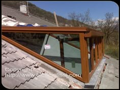 an image of a roof that is missing the shingles and has some windows on it