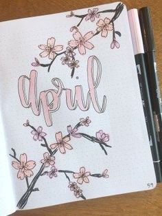 an open notebook with the word'happy'written in pink ink on top of it