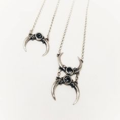 "Lead-free pewter cast barn owl claws with dark gray crystals. Pendant 1.35\" x 2\" Chain is 18\" - 20\" adjustable Always ethically sourced bones. Nothing has ever been harmed for the purpose of our jewelry. All pieces are made-to-order despite the \"in stock\" number in the listing. Time frame varies from piece to piece so please message us if you need something by a certain date and we will do our best. A portion of our profits will be regularly donated to organizations fighting against racis Owl Claws, Skull Collar, Gray Crystals, Crow Necklace, Owl Moon, Raven Necklace, Claw Necklace, Antler Necklace, Baby Necklace