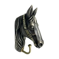 a horse head mounted to the side of a hook