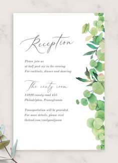 a wedding reception card with greenery on it