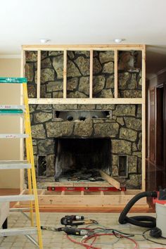 a fireplace being built in a living room