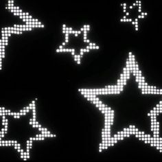 several white stars on a black background