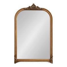 an ornate gold framed mirror on a white background