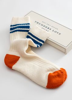 Our Beach Break Socks present a vintage design with three horizontal stripes at the top. They are made with Egyptian cotton yarns, in white and Blue. A long pile with excellent cushioning, unique to this knitting machine, is used for the sole. It absorbs sweats well and relieves fatigue caused by long walks and long periods of standing. We complete the design with a chromatic detail in the tip and in the heel, getting them a vibrant touch. - High quality Egyptian cotton - Hand-linked toe - Skin- Sock Packaging, Product Ads, Birthday Wishlist, Striped Socks, Knitting Machine, Horizontal Stripes, Designer Socks, Egyptian Cotton, Apparel Design