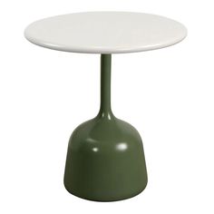 a white table with a green base sitting on top of it's side, against a white background