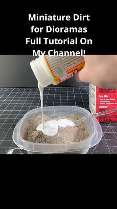 someone is pouring milk into a container filled with sand and other things to make it look like