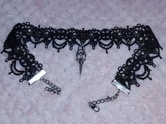 This gorgeous handmade black lace choker is absolutely stunning and has a gorgeous silver plated crow skull charm attached, giving off glam goth vibes for days 🖤 The lace part measures 12" and the choker as a whole measures 17" including clasp and extender chain... I can make the lace/ chain longer or shorter no problem, so if you need the measurements adjusting just let me know on the order and I can make it to fit your measurements 🖤 Gothic Choker Necklace For Alternative Fashion, Handmade Edgy Choker For Halloween, Gothic Black Choker For Alternative Fashion, Black Gothic Choker For Alternative Fashion, Gothic Choker For Halloween And Alternative Fashion, Black Emo Choker For Halloween, Emo Black Choker For Halloween, Emo Silver Choker For Halloween, Edgy Halloween Party Choker