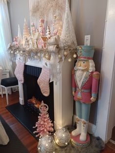 a fireplace decorated with christmas decorations and ornaments