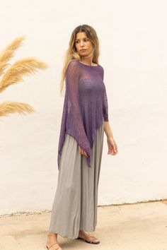 Eggplant purple sheer poncho to wear as a boho chic multiple way dress cover up. Perfect as an off the shoulder knitted poncho for a boheme style. Its simplicity and versatile design gives this poncho many possibilities, whether you want to wear it as a shawl, cape, scarf, dress cover up or even as shrug. The perfect accessory for spring days or those cool summer nights, adding a pop of color to a simple tank top and jeans outfit or even to a wedding garment. The poncho is made of soft, light an Cheap Women's Shawl Poncho, Boho Dress With Scarf, Lightweight Dress Cover Up, Luxury Chic Poncho For Spring, Scarf As A Poncho, Poncho From Shawl, Poncho Outfit Summer, Tank Top And Jeans Outfit, Top And Jeans Outfit