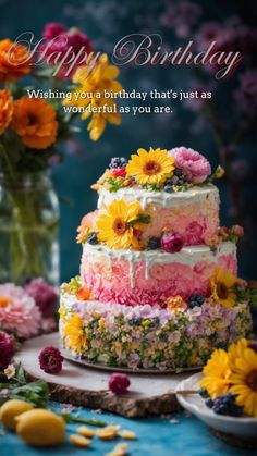 a colorful birthday cake with flowers on it and the words happy birthday written in large letters