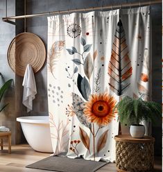 a shower curtain with an orange flower and leaves on it next to a bathtub