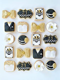 decorated cookies arranged in the shape of bow ties and tuxedo's on display