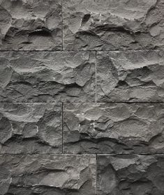 a stone wall that is made out of different types of rocks