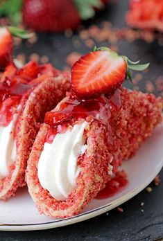 strawberry shortcakes with whipped cream and fresh strawberries on the side, ready to be eaten