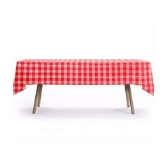 a red and white checkered tablecloth with wooden legs