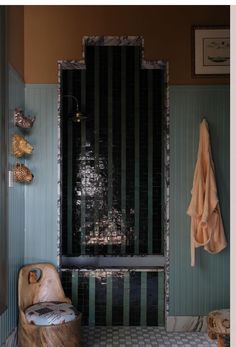 a bath room with a wooden bench and tiled floor