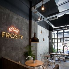 the restaurant is decorated with neon signs and chairs