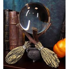 If you are big into Wiccan and witchcraft and all things supernatural, this figurine is an awesome collectible! It is beautifully designed and painted, with the cauldron brewing potions and broomsticks crisscrossed ready to fly. To add to the coolness of this figurine, we set a glass ball on the top so that you can gaze into it and access another portal of the supernatural realm! This witch broomstick and cauldron gazing ball is made of designer composite resin and glass, hand-painted and polish Witches Decor, Witch Broomstick, Witches Broomsticks, Three Witches, Witches Altar, Wiccan Witch, Gazing Ball, Witch Cat, Witch Decor