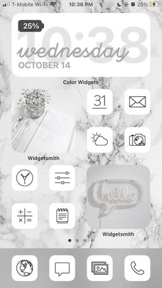 an iphone screen with the date and time on it, next to a white marble background