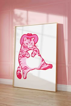 a pink poster with a cat wearing a hat on it's back in front of a pink wall