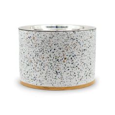 a white and gold planter with speckles on the outside, in front of a white background