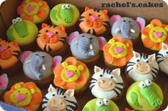 a box filled with lots of cupcakes decorated like animals