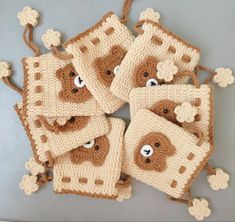 crocheted coasters with teddy bears on them are arranged in the shape of squares