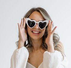 Celebrate in style with our Hen Party Sunglasses, featuring Bride Pearl Heart Sunglasses that make the perfect gift for the bride. These chic accessories are also ideal as bridesmaid gifts, adding a fun and fashionable touch to your bachelorette party 𝐃𝐄𝐓𝐀𝐈𝐋𝐒 💍 Elegant pearl details 💍 Heart shaped sunglasses 💍 Multiple colours available! Pink, Black or White  💍 One size fits all 𝐇𝐎𝐖 𝐓𝐎 𝐎𝐑𝐃𝐄𝐑 1) Select your color   2) Select your style 3) Add to Cart  4) Choose your shipping Elegant Heart-shaped Party Sunglasses, Elegant Valentine's Day Party Sunglasses, Bridesmaid Sunglasses, Sunglasses Bride, Sunglasses Bachelorette, Bride Sunglasses, Fitted Gowns, Vegas Bachelorette, Rose Noir