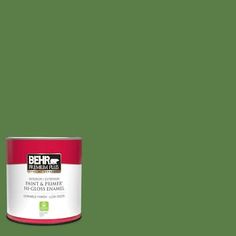 a green paint can with the words behrk on it in red and white