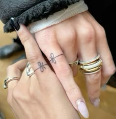 two people with matching rings on their fingers