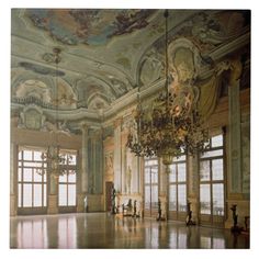 an ornately decorated room with chandeliers and large windows